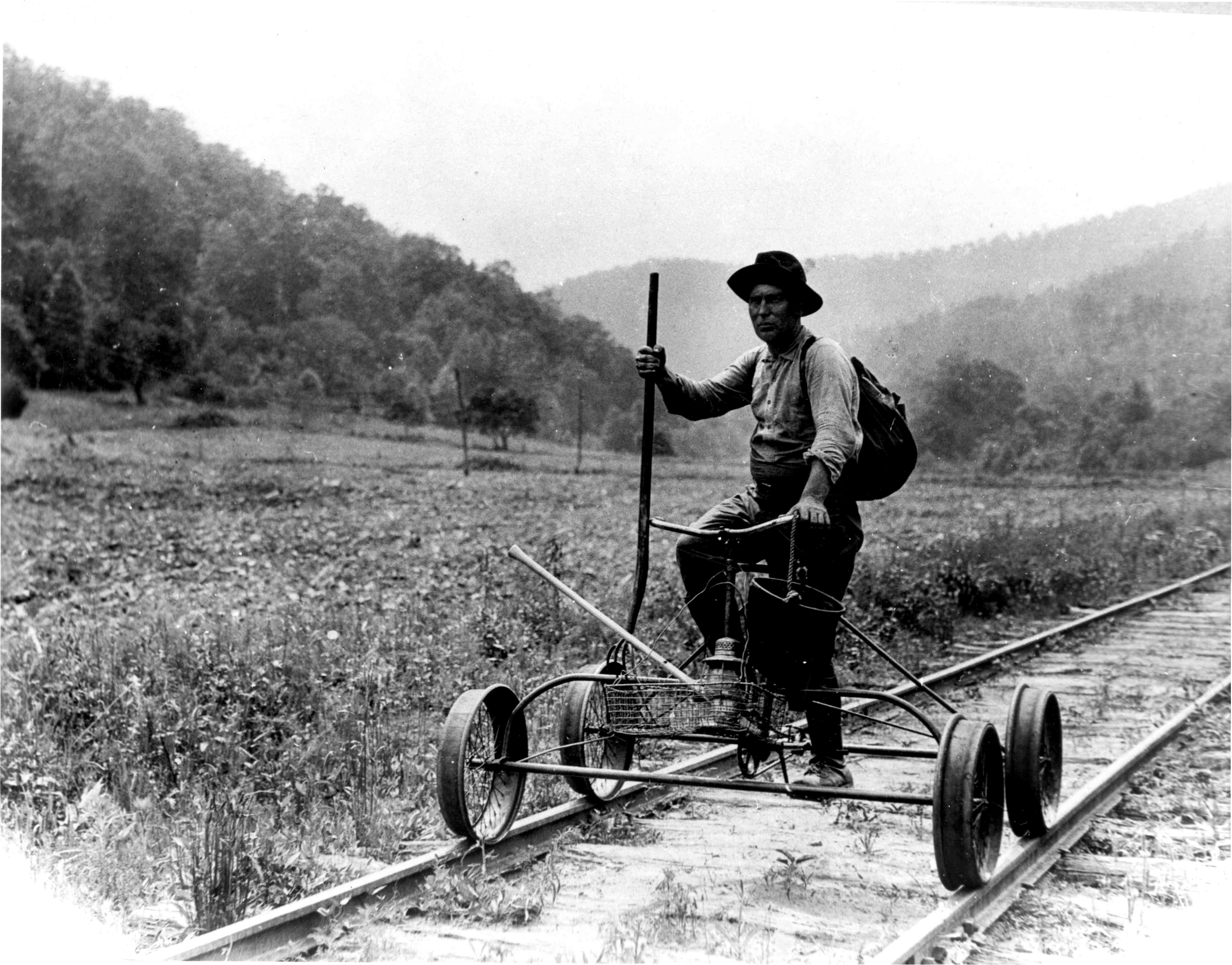 Perry Davis on a railway pedal cart, 1928, photographed by Joseph Wilde
